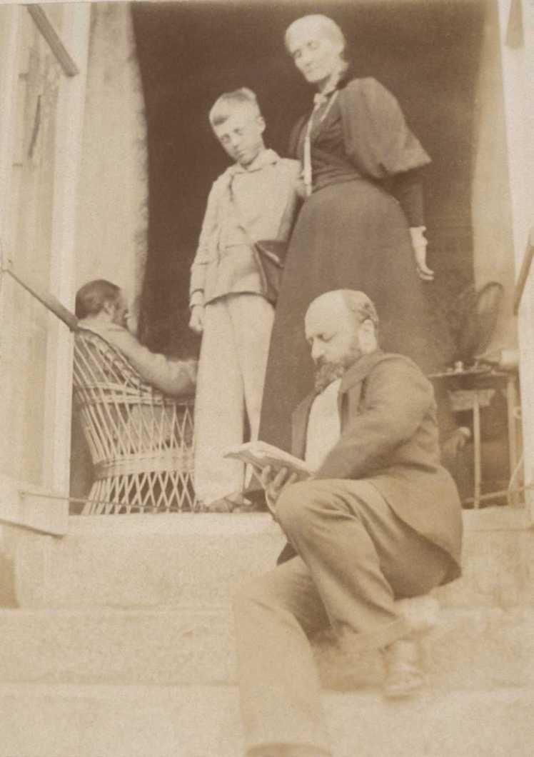 Henry James sitting on the steps at Talland House. Above him is Julia Stephen and Adrian Stephen. Photo from Smith College, MA https://www.smith.edu/libraries/libs/rarebook/exhibitions/stephen/38l.htm